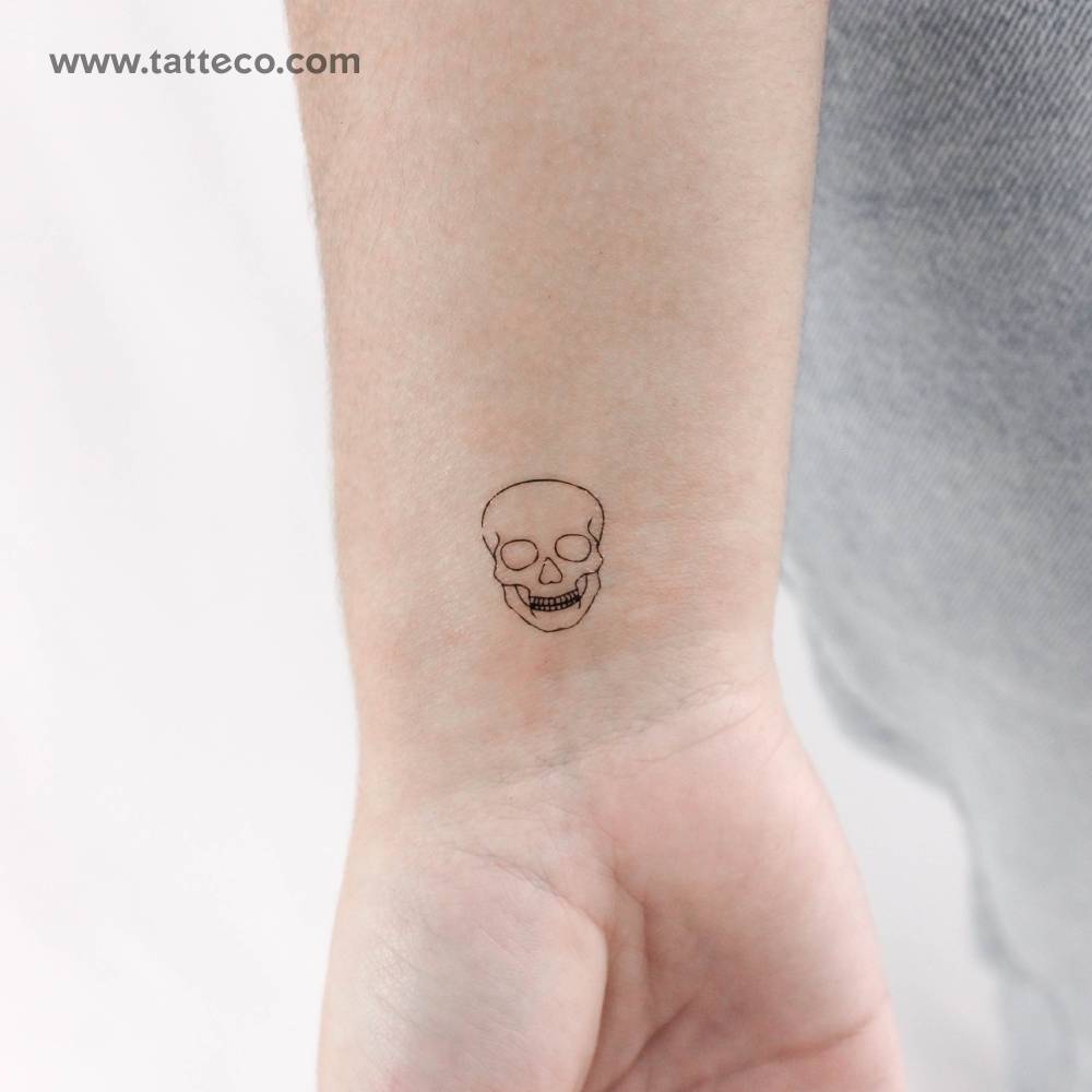 Fine line style skull temporary tattoo done on the wrist.