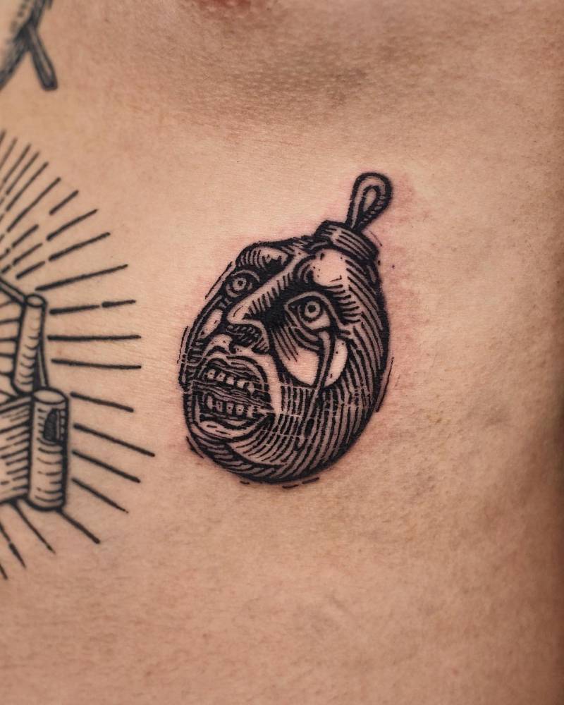 Behelit from Berserk tattooed on the rib, engraving style.