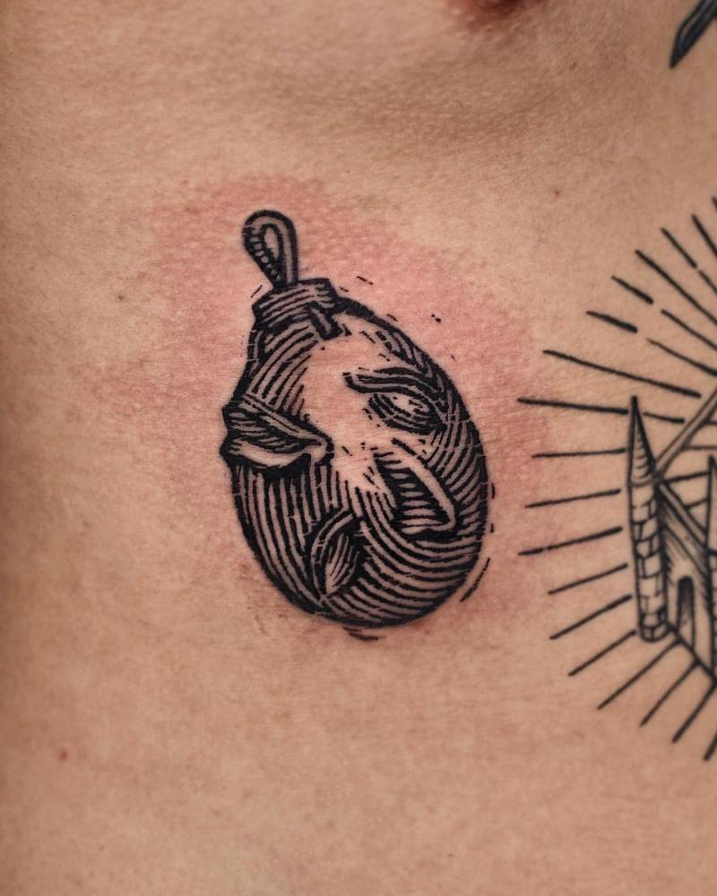 Behelit from Berserk tattooed on the rib, engraving style.