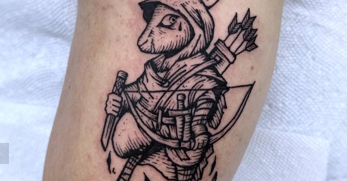 Archer rabbit tattoo in engraving style located on the
