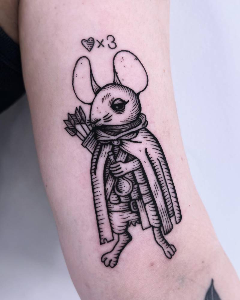 Engraving style archer mouse tattoo located on the bicep.