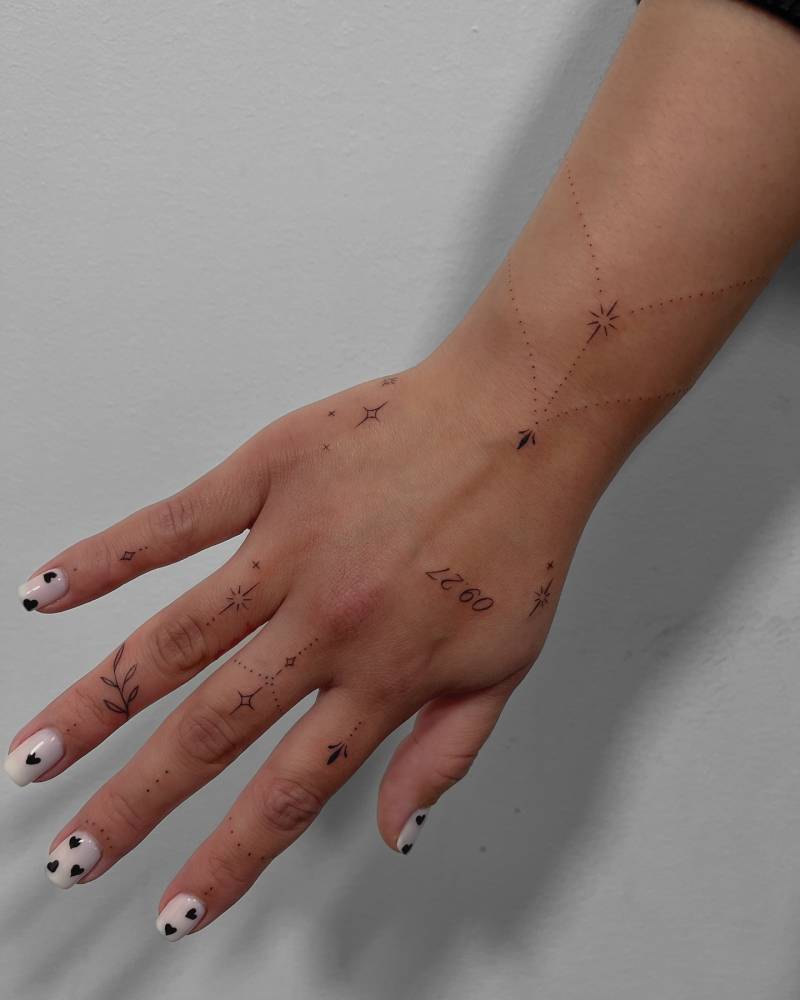 Fine line style hand composition tattoos.