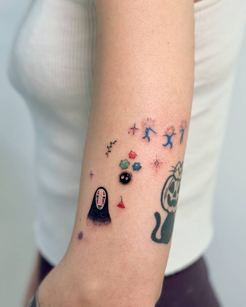 Kaonashi and Soot Sprite tattoo located on the upper arm.