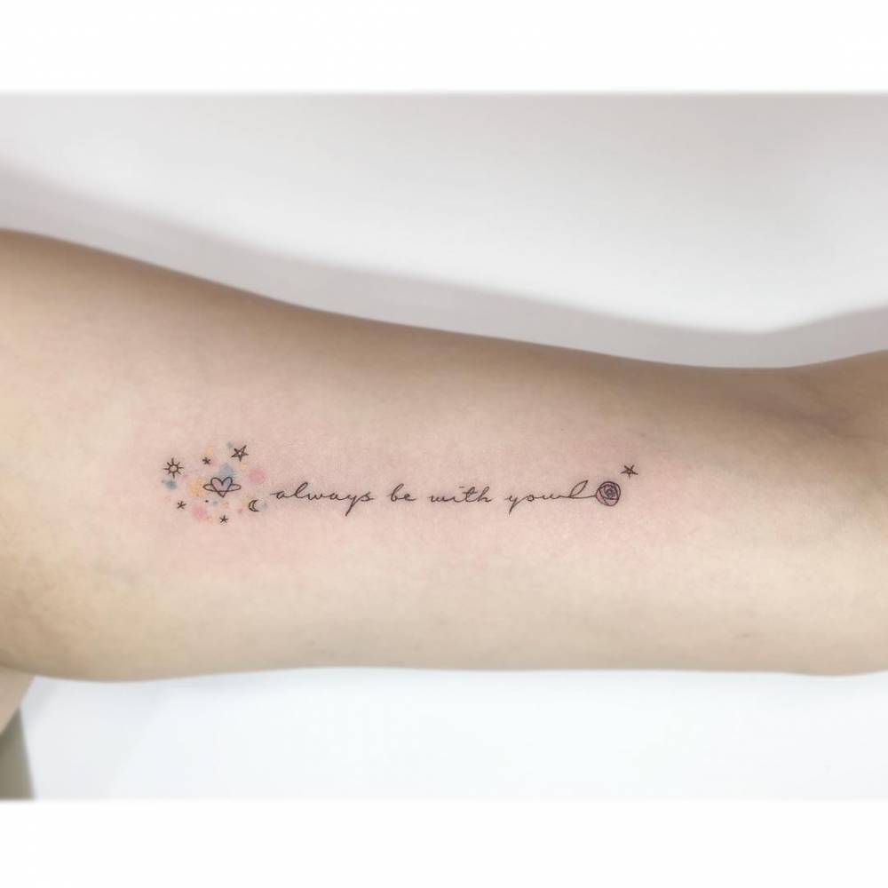 "Always be with you", galaxy and rose tattoo located on the inner arm.