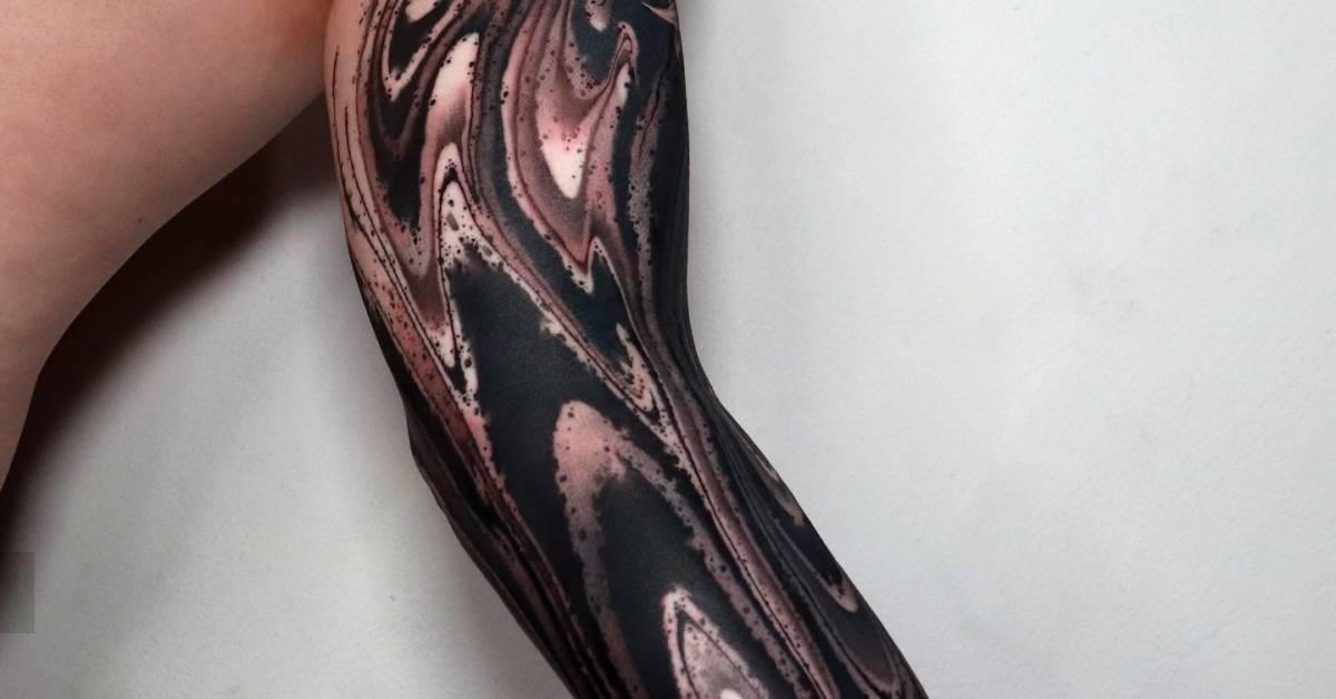 Abstract tattoo sleeve in blackwork style.