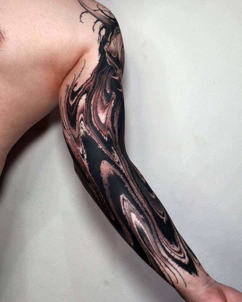 Abstract tattoo sleeve in blackwork style.
