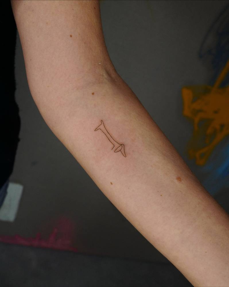 Picasso's 'Le Chien' tattoo located on the inner forearm.