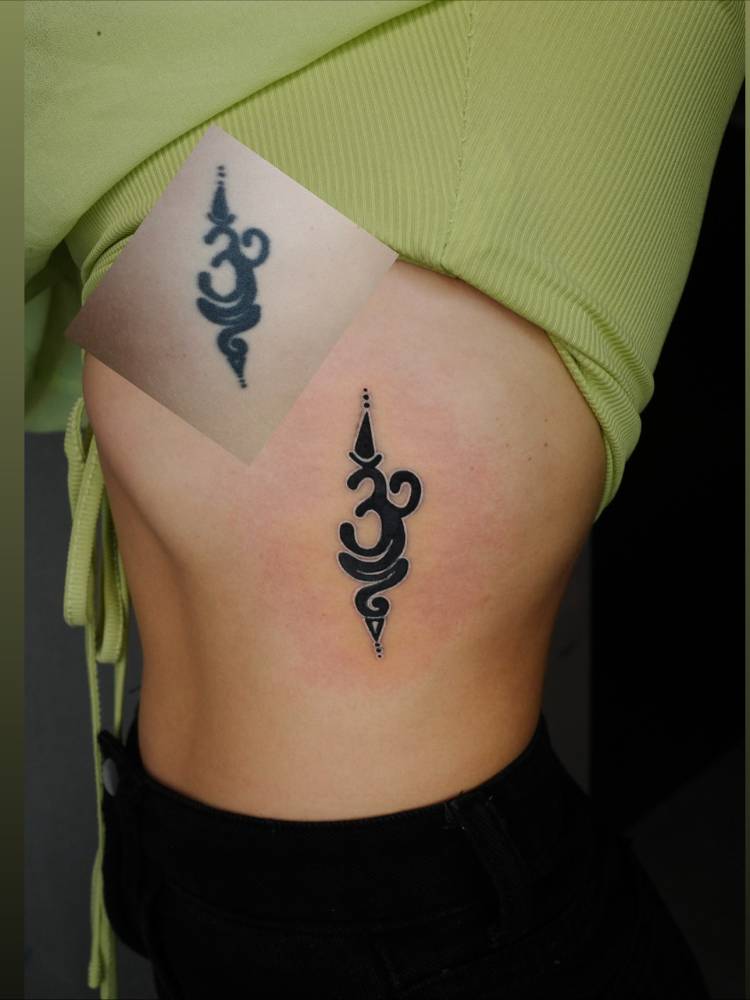 Sanskrit OM tattoo touch up,