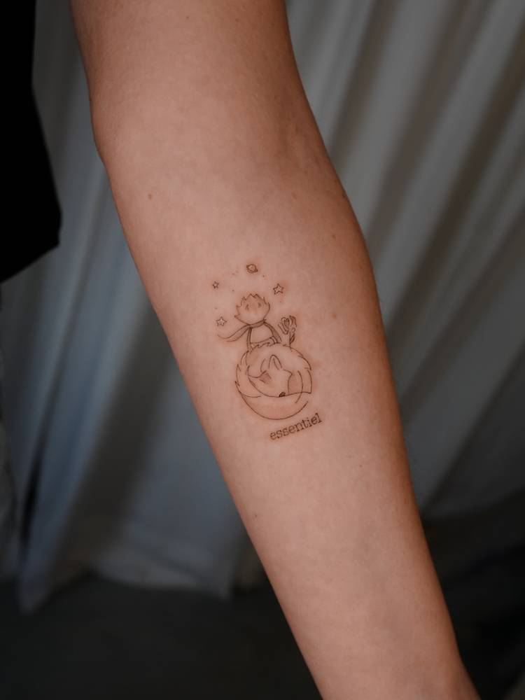 The Little Prince tattoo located on the inner forearm.