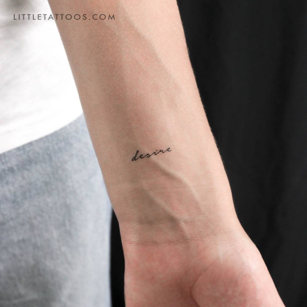 Handwritten font "desire" temporary tattoo located on the wrist.