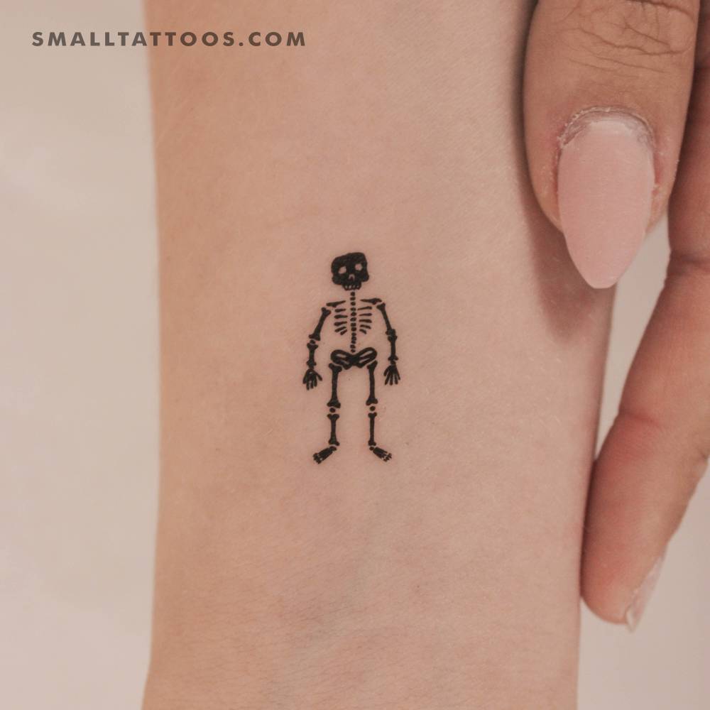 Little skeleton temporary tattoo located on the wrist.