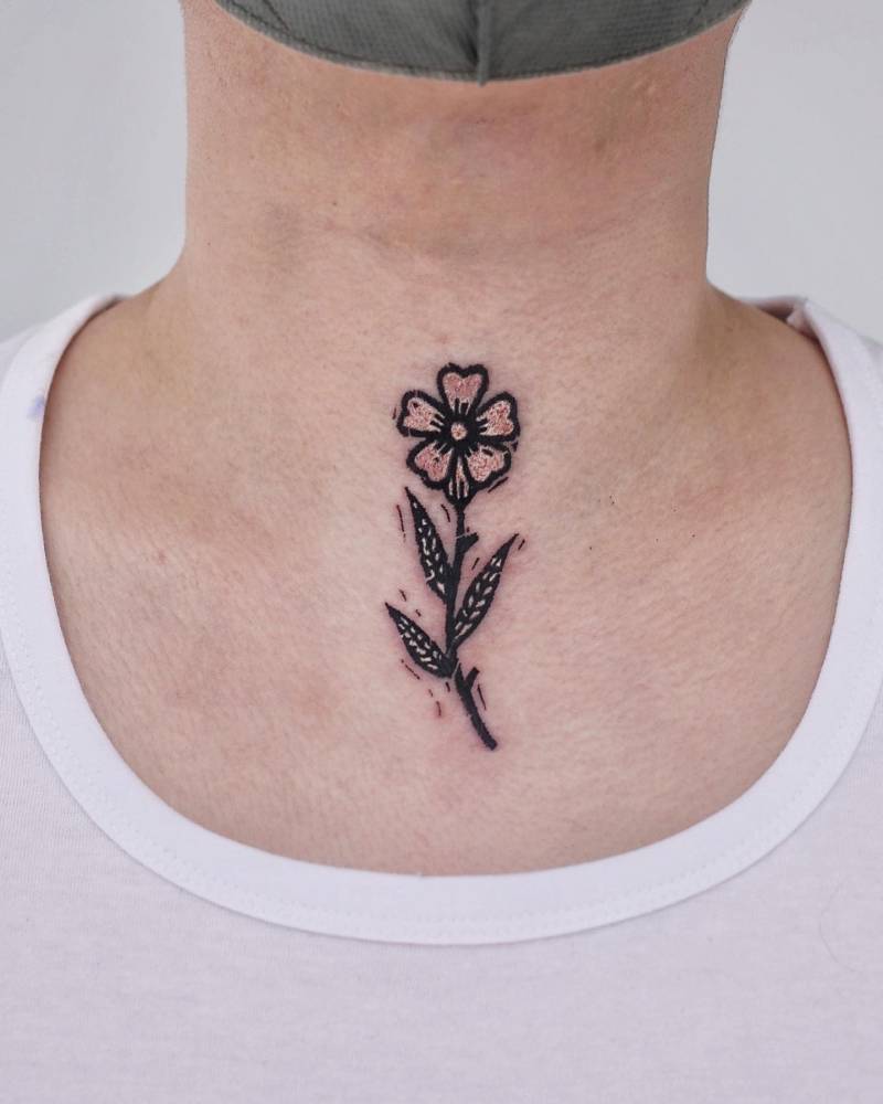 Pop art style flower tattoo placed on the throat.