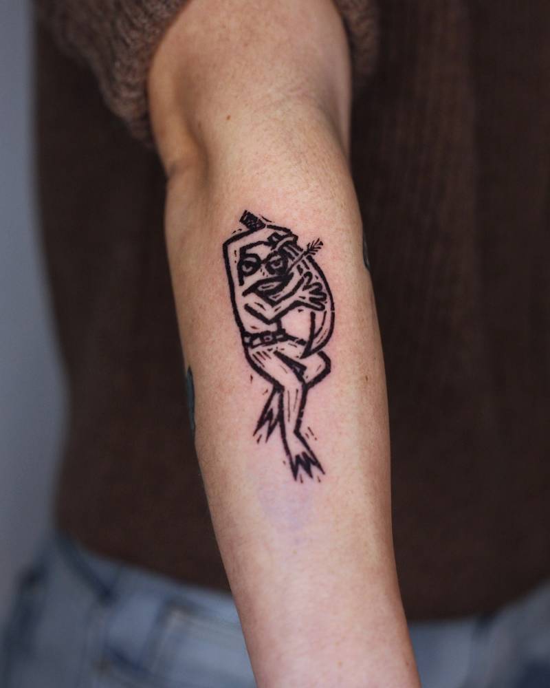 Assassin frog tattoo located on the forearm.