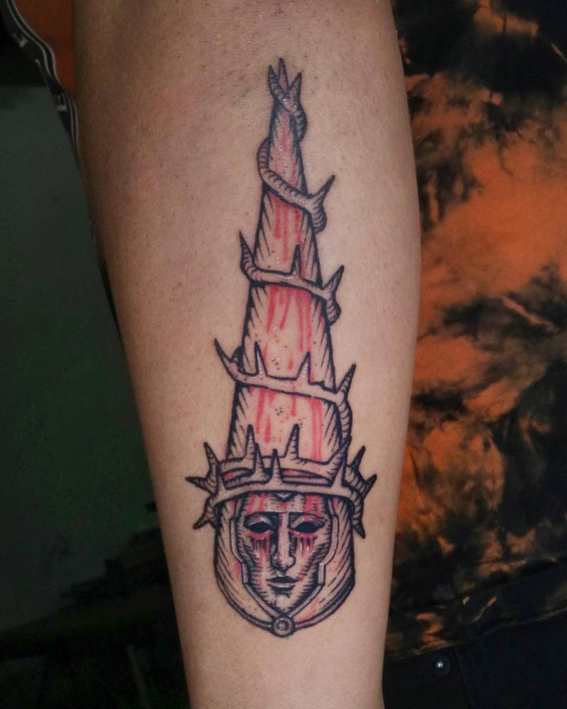 Penitent One from 'Blasphemous' tattooed on the inner forearn.