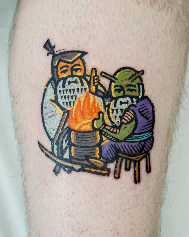 Gnome Piccolo and samurai gnome tattoo located on the shin.
