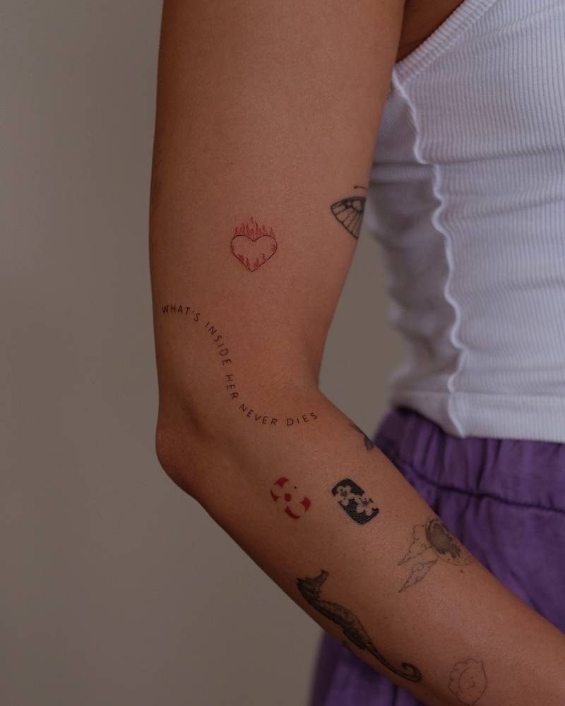 Arm composition tattoos.