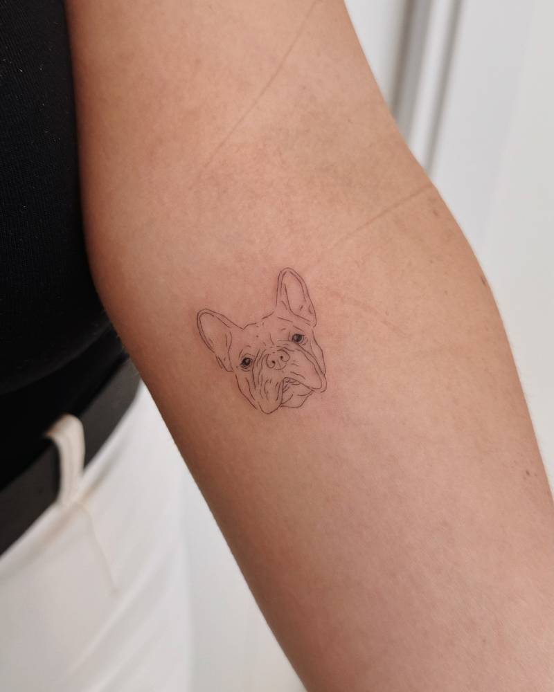 French Bulldog portrait tattoo located on the inner forearm.