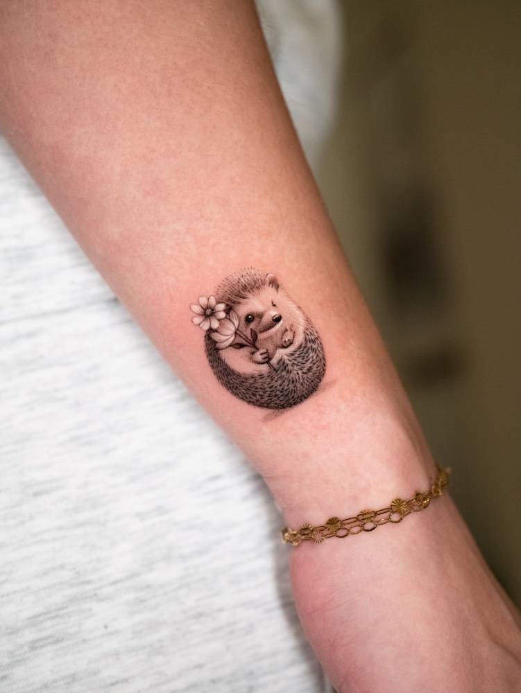 Cute little hedgehog tattoo done on the wrist.