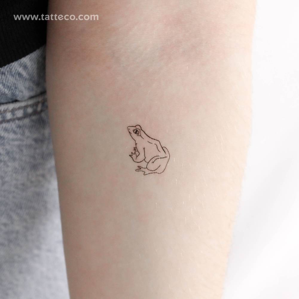 Fine line style frog temporary tattoo done on the inner forearm.