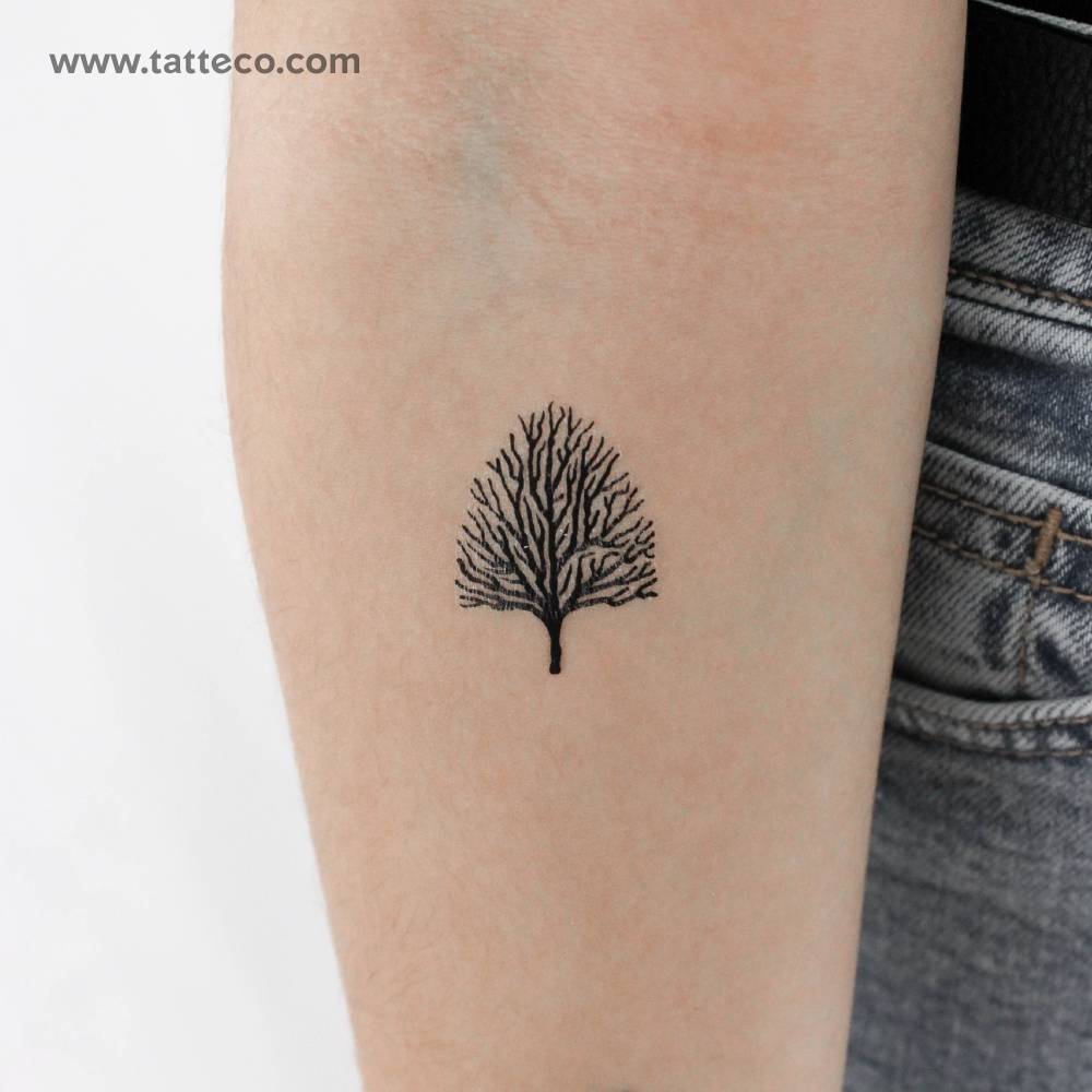 Leafless tree temporary tattoo located on the inner forearm.