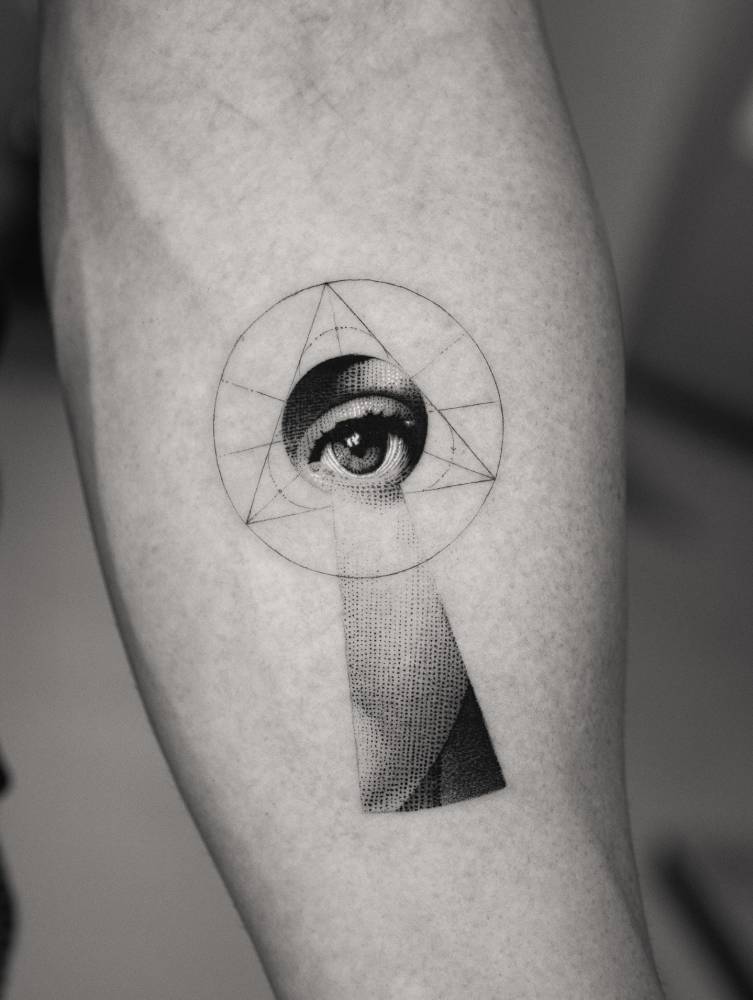 Fornasetti Tema e Variazioni 14 tattoo located on the inner forearm.