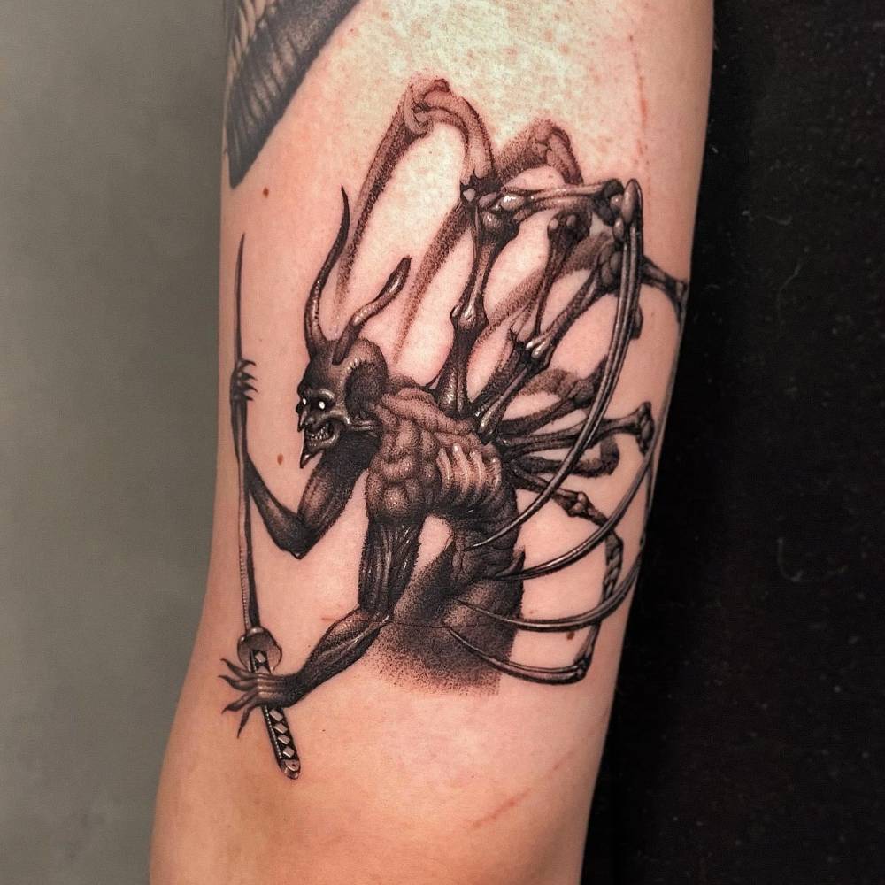 Dotwork style devil samurai tattoo located on the upper arm.