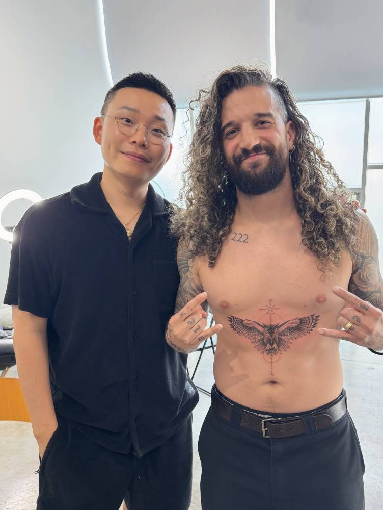 Black and grey owl tattoo located on Mark Ballas' stomach.