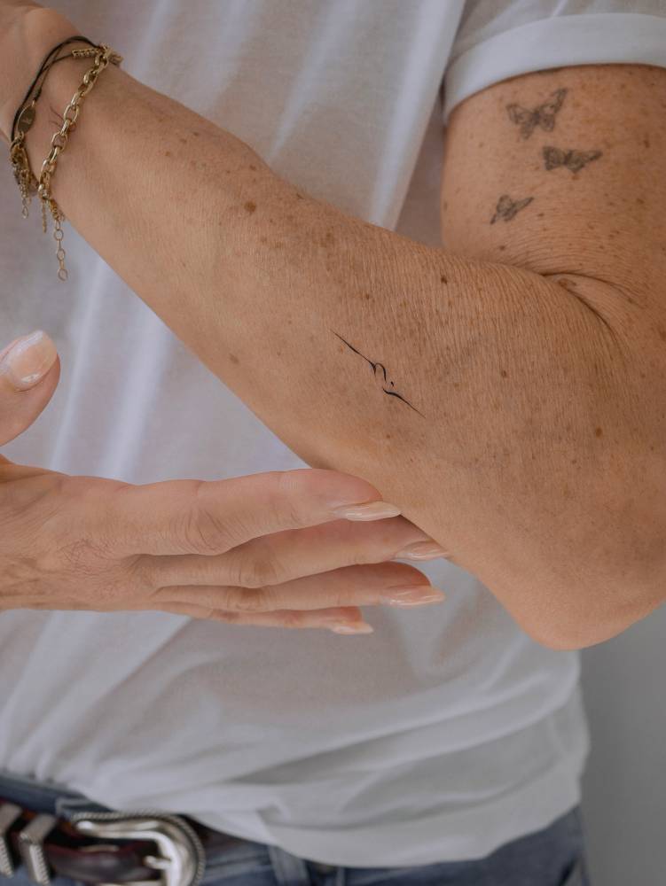 Abstract ornament tattooed on the forearm.