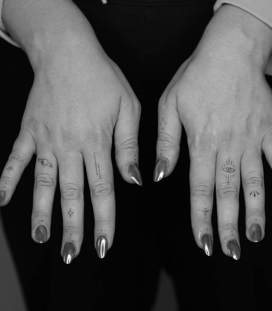 Finger composition tattoos in minimalistic style.
