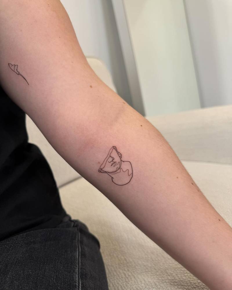 Fine line style sculpture tattoo located on the inner forearm.