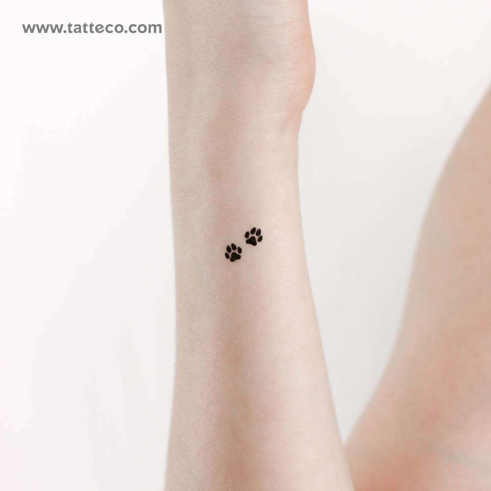 Tiny minimalistic dog paw couple temporary tattoo.