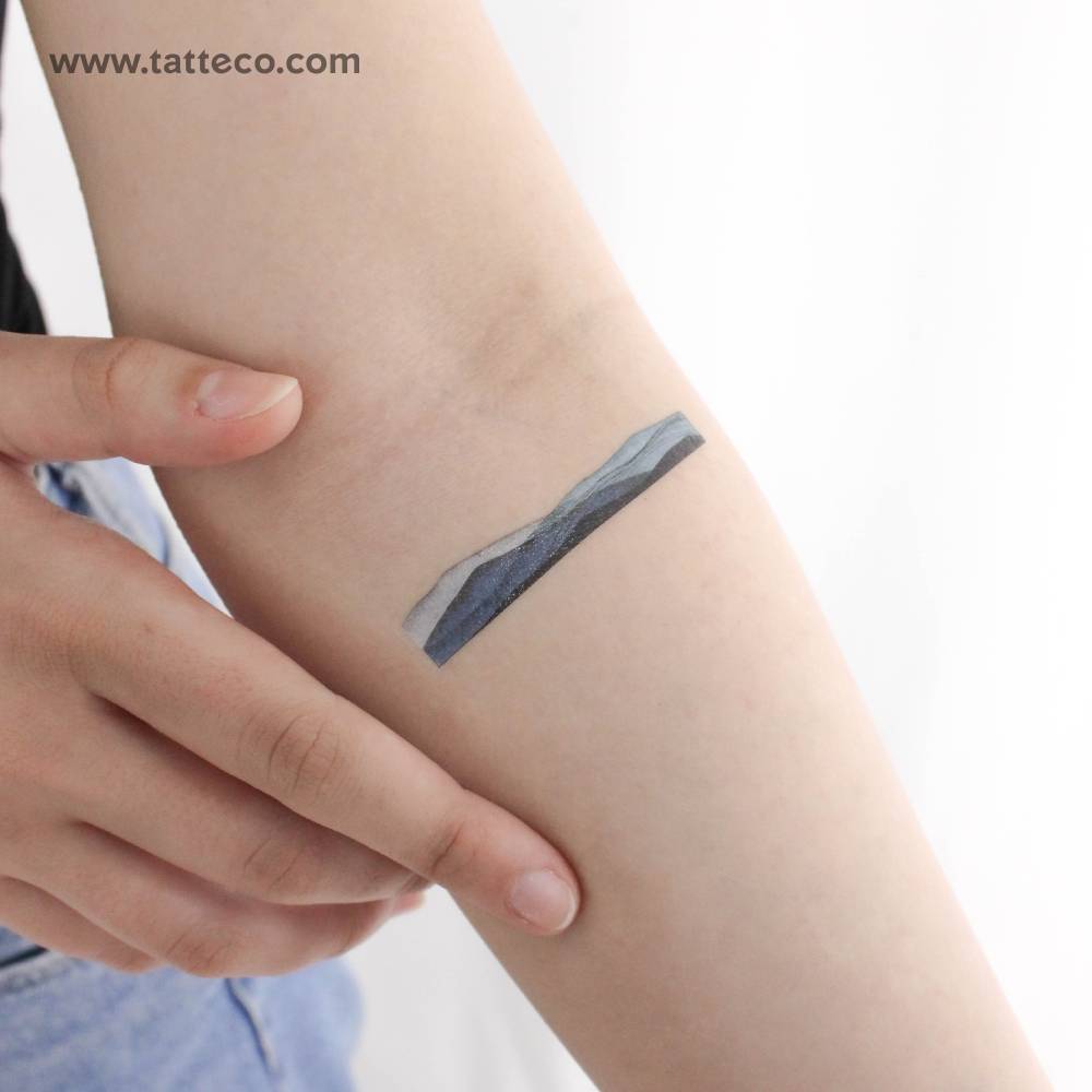 Watercolor style mountain range by Ann Lilya temporary tattoo.
