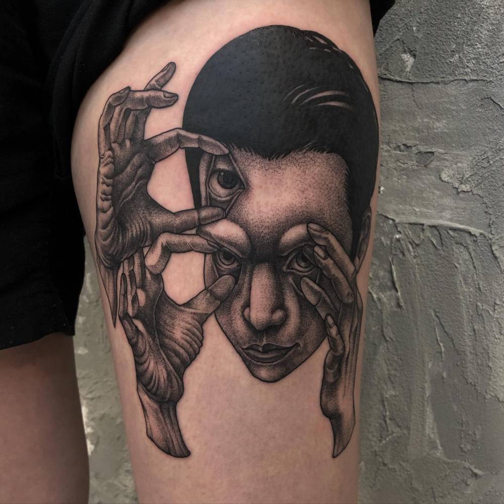 Surrealistic style hands opening eyes tattoo located on the thigh.
