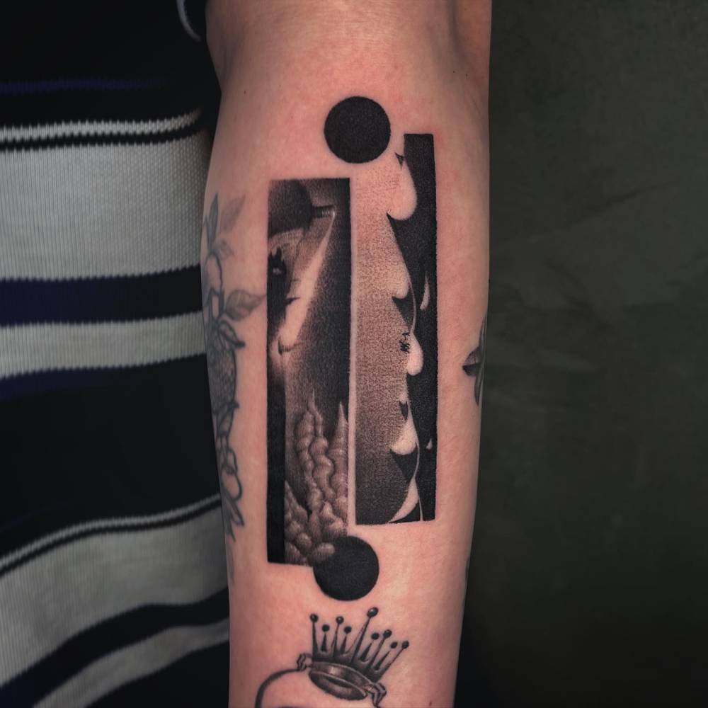 Dotwork style sea and desert landscapes tattooed on the forearm.