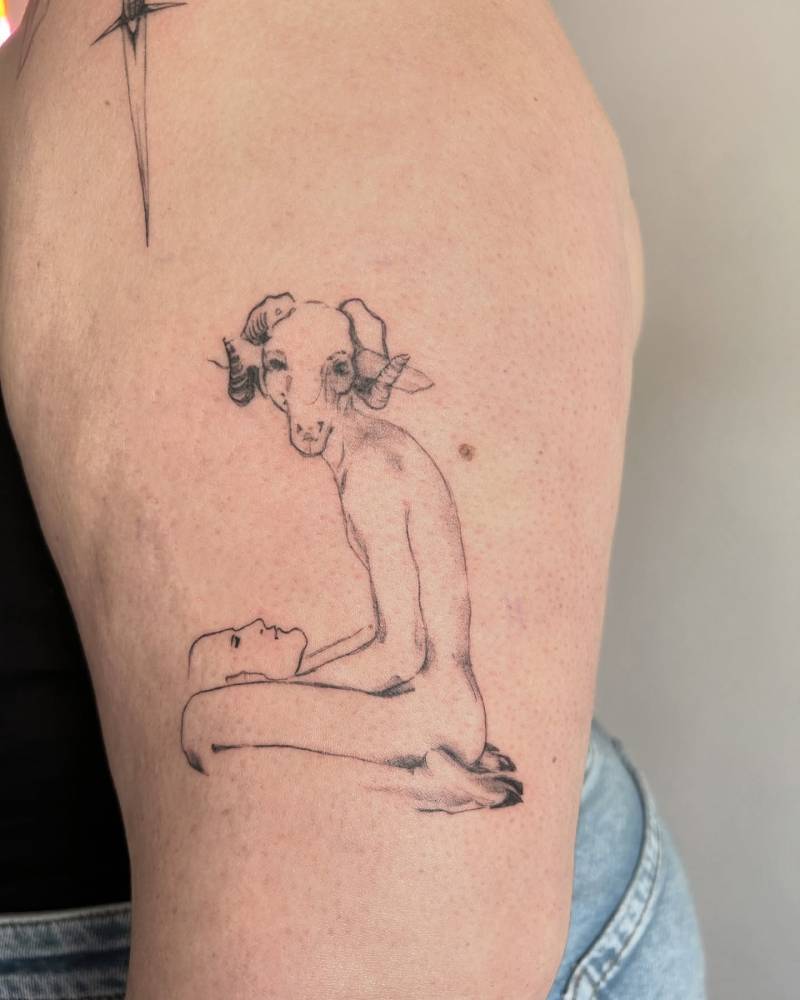 Anthropomorphic ram tattoo located on the upper arm.