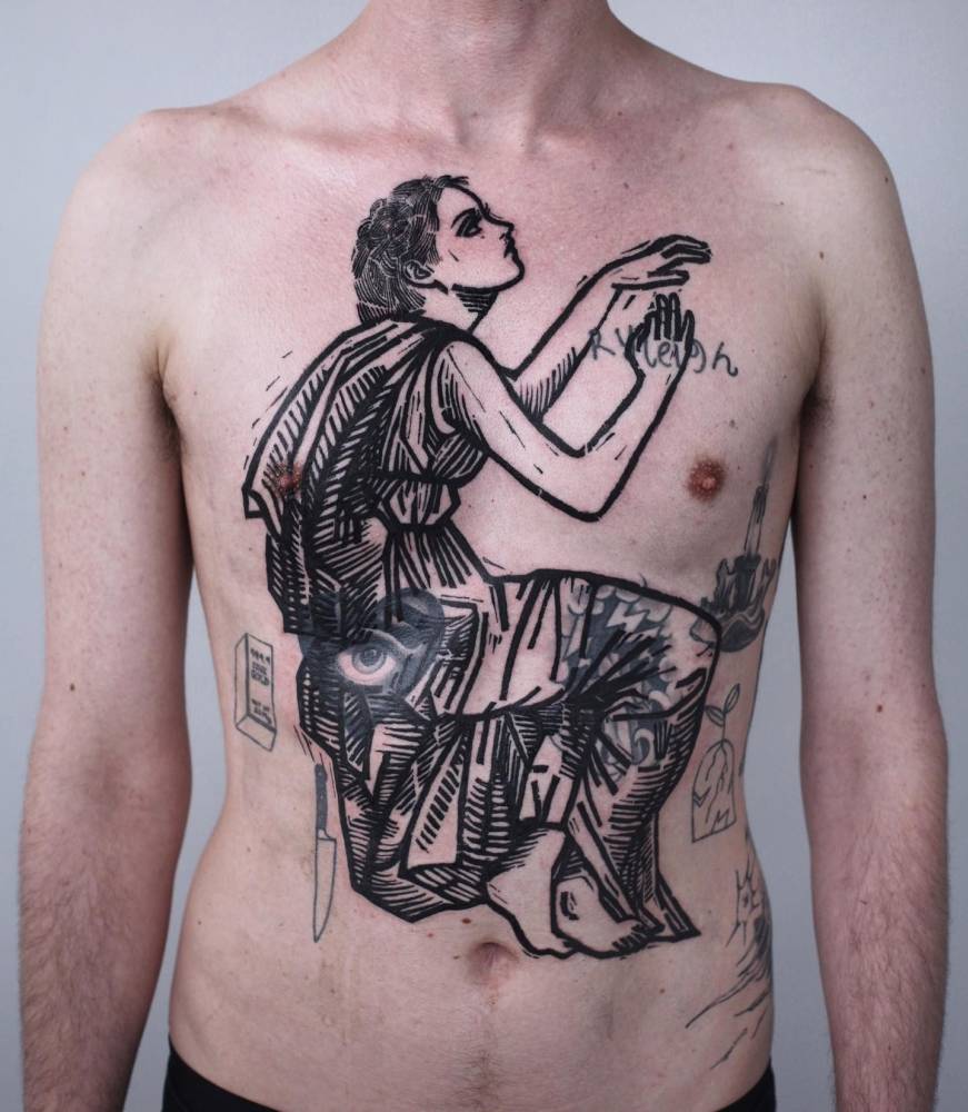 Engraving style Greek woman cover up tattoo located on the torso.