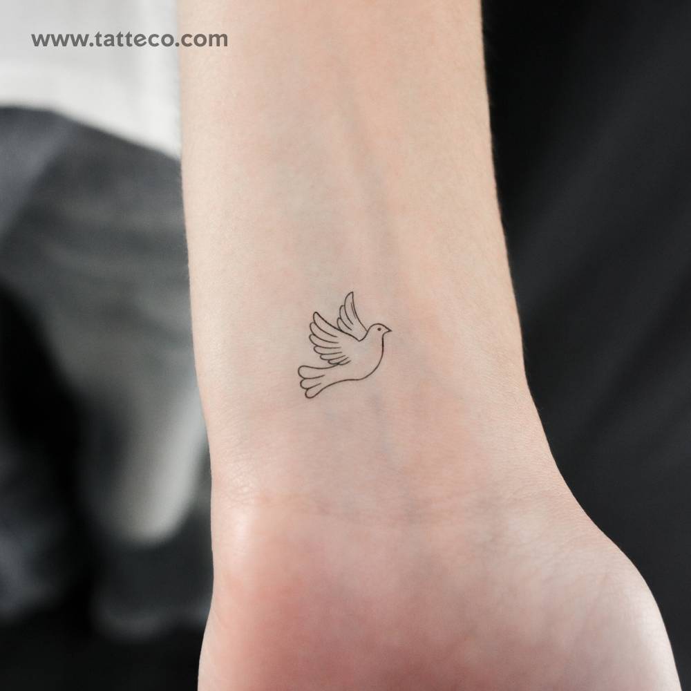 Little minimalistic dove temporary tattoo located on the wrist.