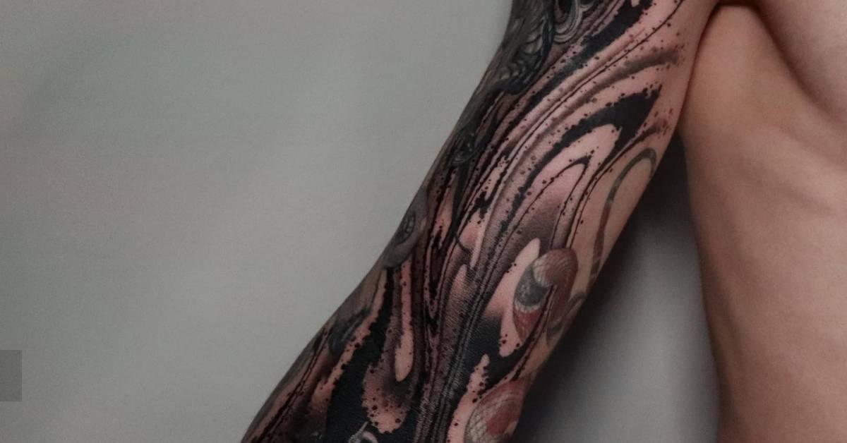Blackwork style abstract cover up tattoo located on the