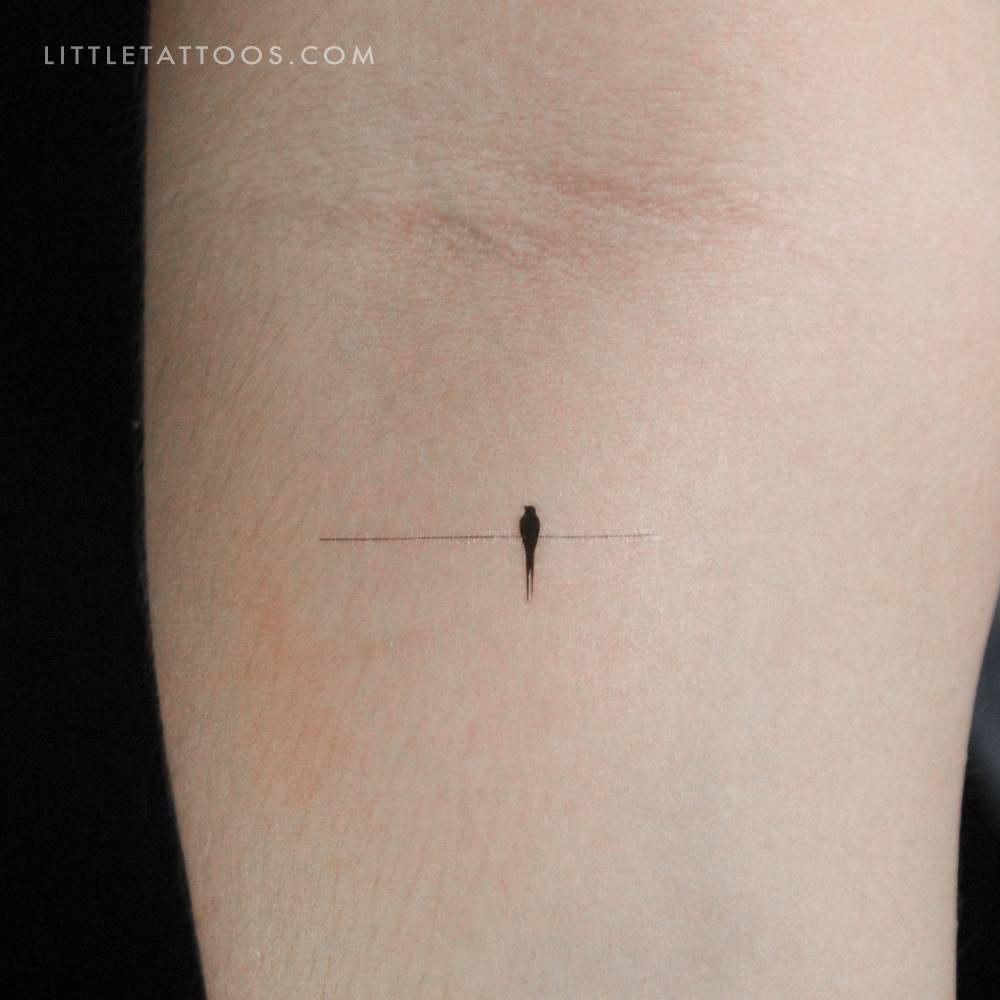 Minimalistic style lonely bird on a wire temporary tattoo.