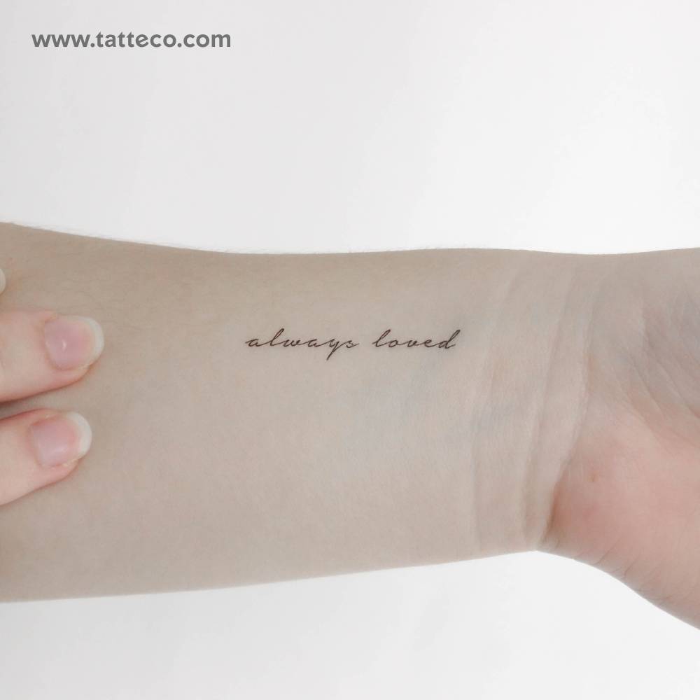 Handwritten font "always loved" temporary tattoo located on the wrist.