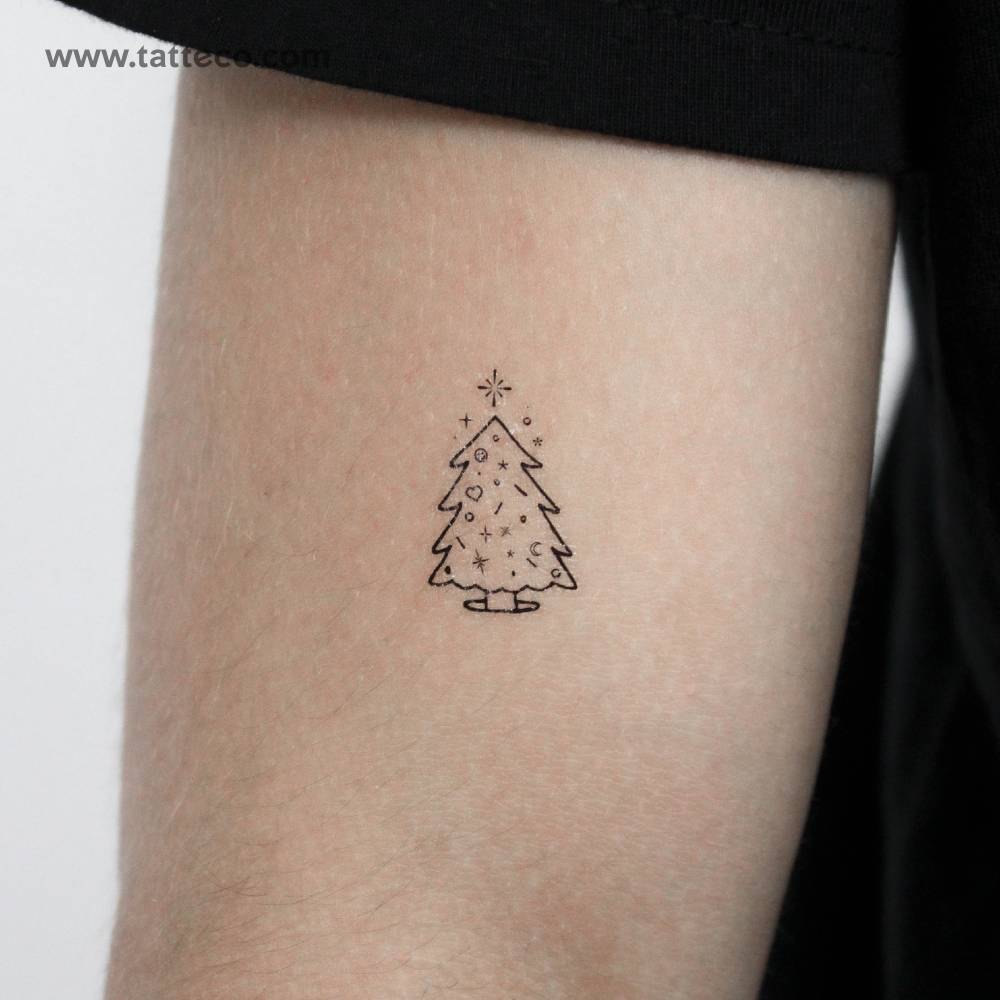 Christmas tree temporary tattoo located on the upper arm.