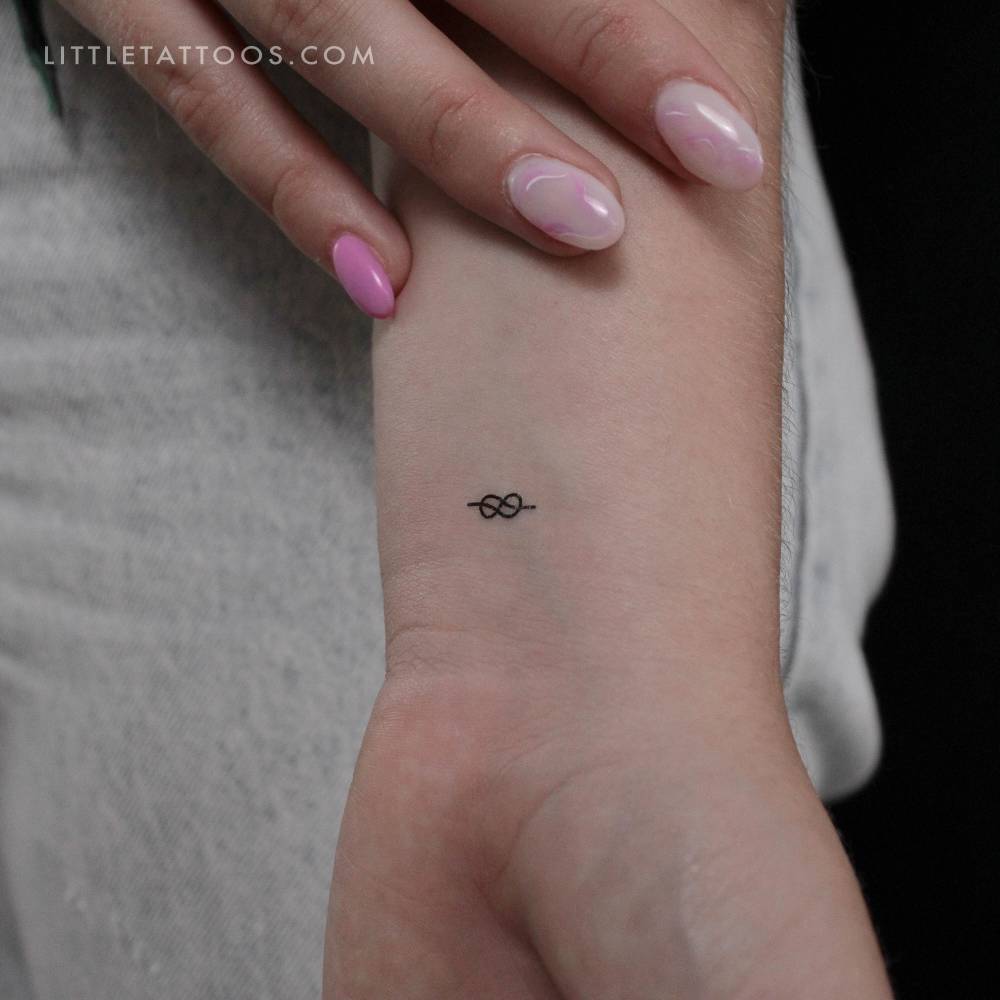 Small minimalistic sailor knot temporary tattoo located on the wrist.