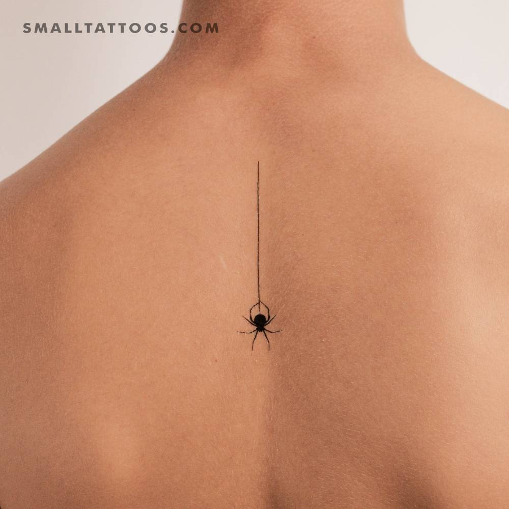 Minimalistic style hanging spider temporary tattoo located on the upper back.