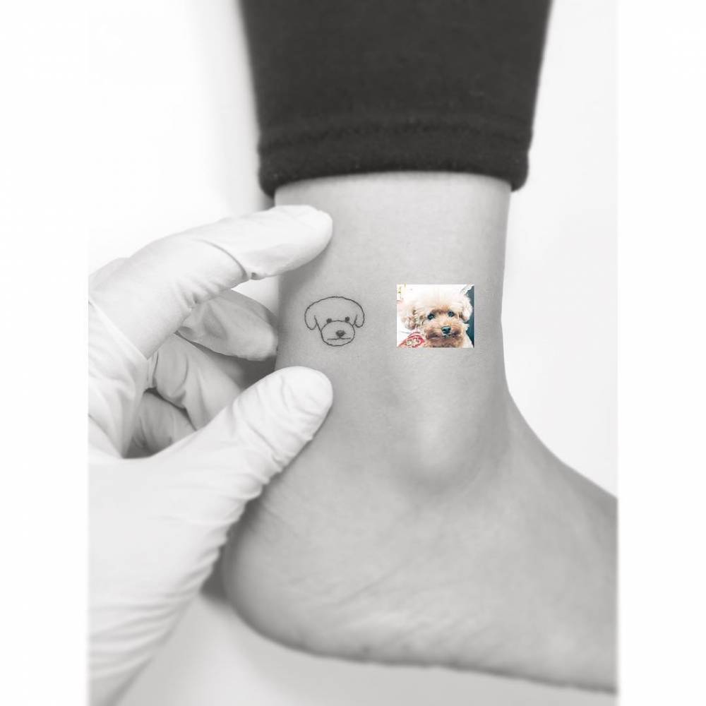 Minimalistic style poodle portrait tattoo located on the ankle.