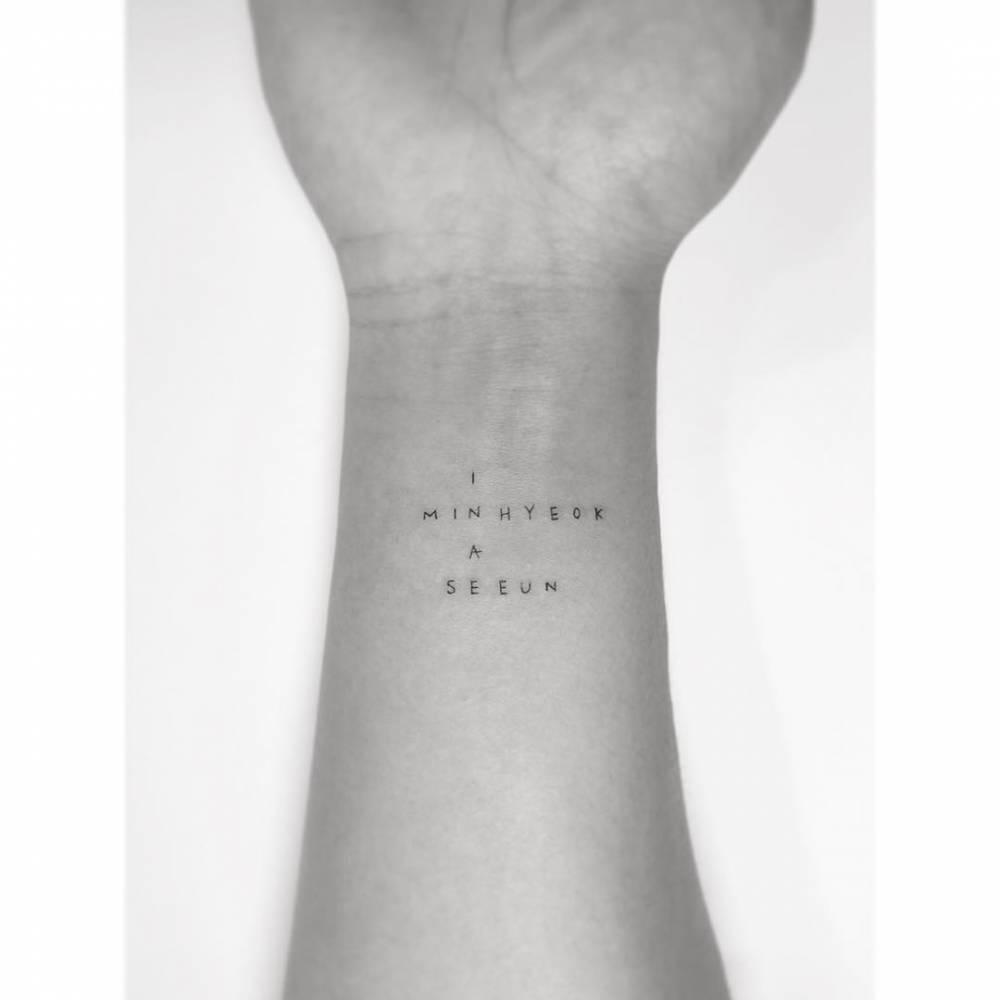 Family name tattooed on the wrist.