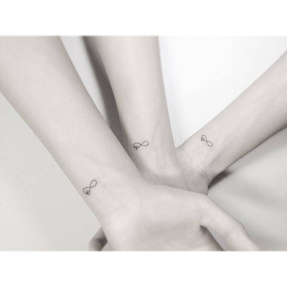 Matching infinity heart tattoos for best friends.