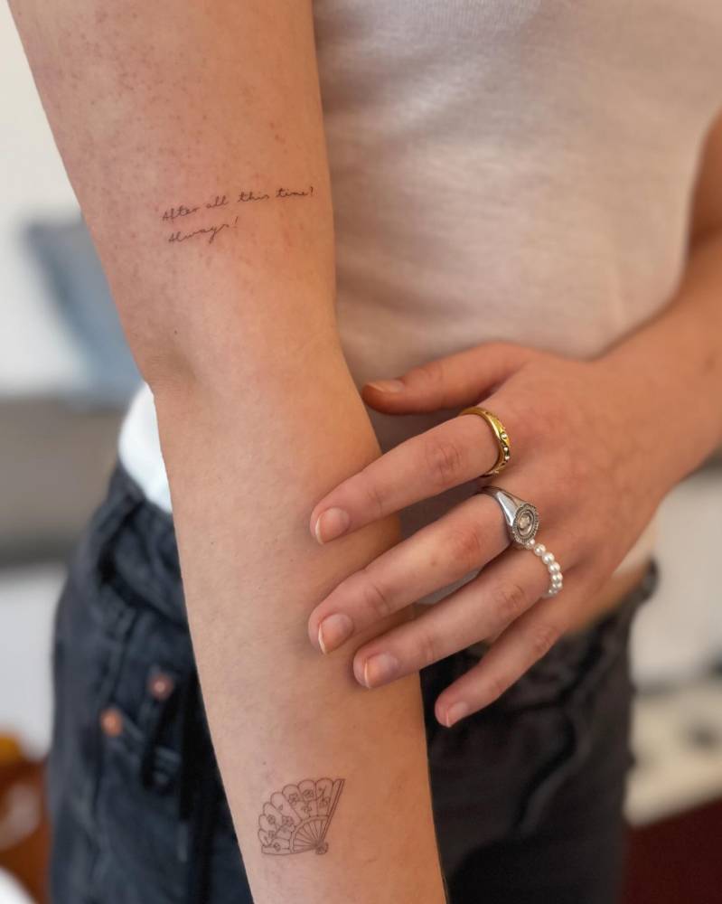 "After all this time, always" lettering tattoo located on the upper arm.