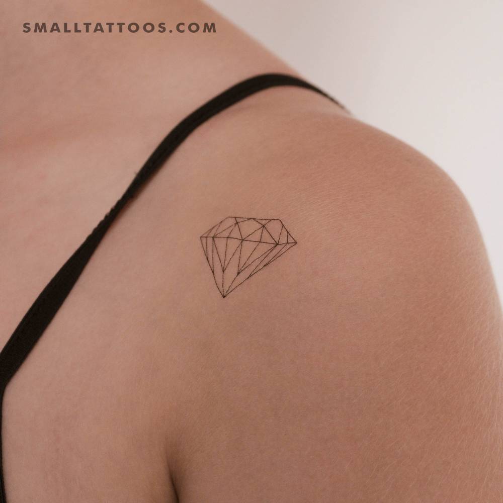Fine line style diamond temporary tattoo located on the shoulder.