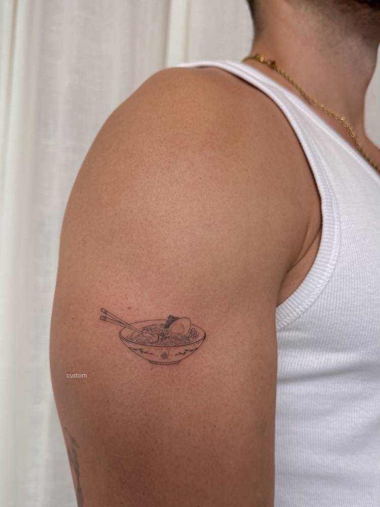 Ramen tattoo located on the upper arm, done in illustrative style.