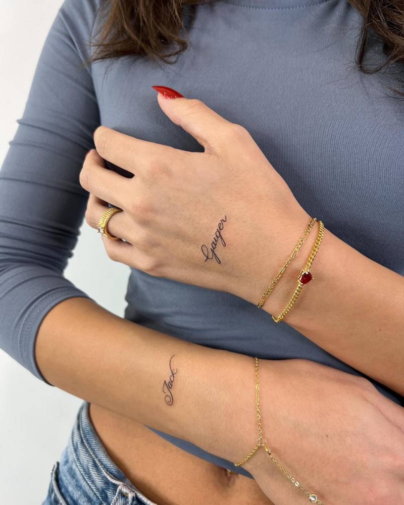 Individual matching names tattooed on the hand and wrist.
